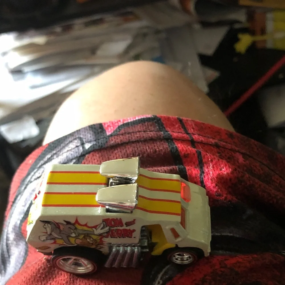 Vintage Toy Car with Yellow & Orange Racing Stripes